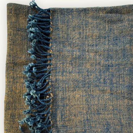 Handspun cotton in warm ochre and deep indigo, hand-woven in Northeastern Thailand by women-led weaving groups in Thailand. Plant-dyed. 80 × 200 cm.