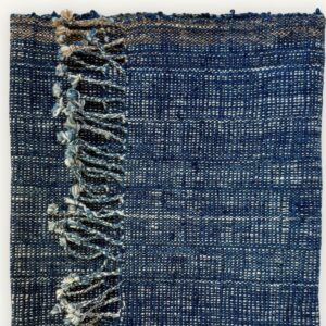 Handspun cotton in natural indigo tones, hand-woven in Northeastern Thailand by women-led weaving groups in the Khon Kaen region. Plant-dyed with fermented indigo leaves. 40 × 200 cm.