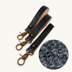 3 black key fobs with one black highlighted - fish leather structure