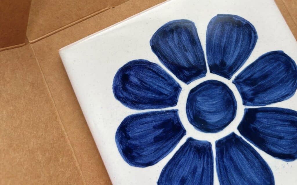 Handpainted ceramic tile with blue flower as gift for Portugal lovers