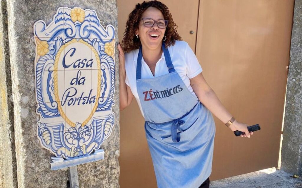 Maribel next to azulejos facade